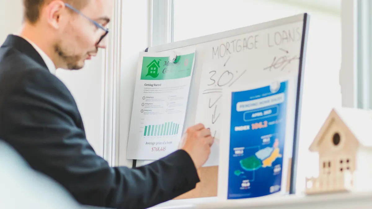 Man presenting a mortgage loan comparison chart